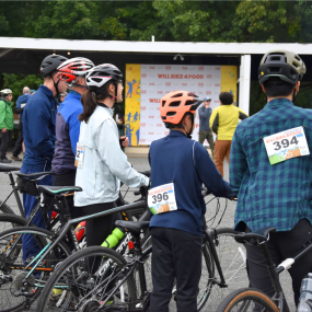 A family of cyclists line up to kick off a ride at Will Bike 4 Food.