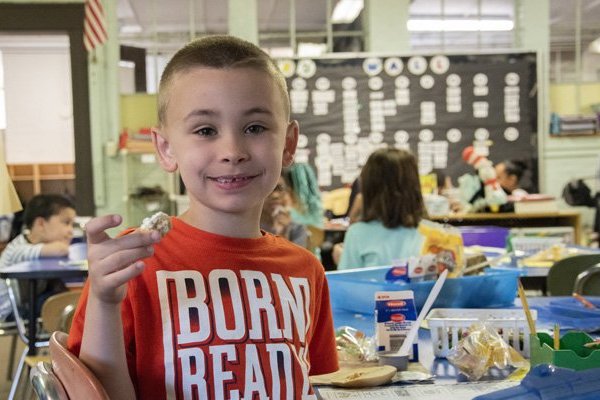 boy holding breakfast